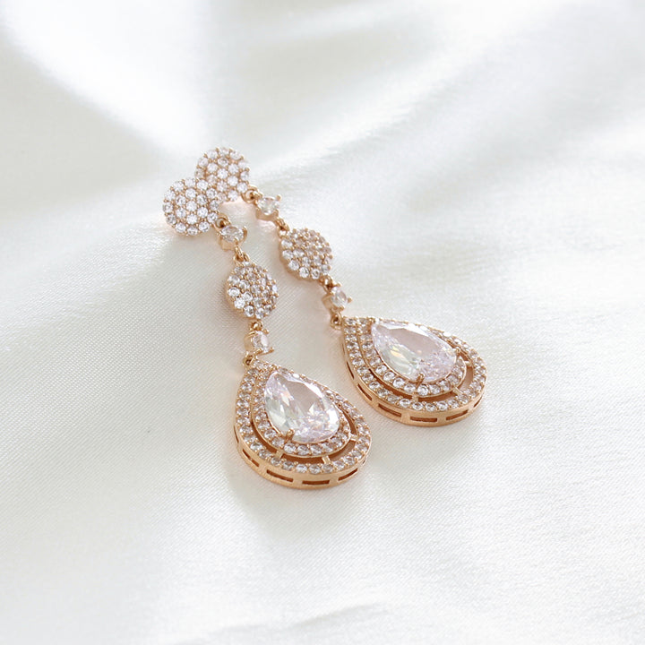 Sidney Rose Gold Statement Drop Earrings with cubic zirconia crystal teardrops.