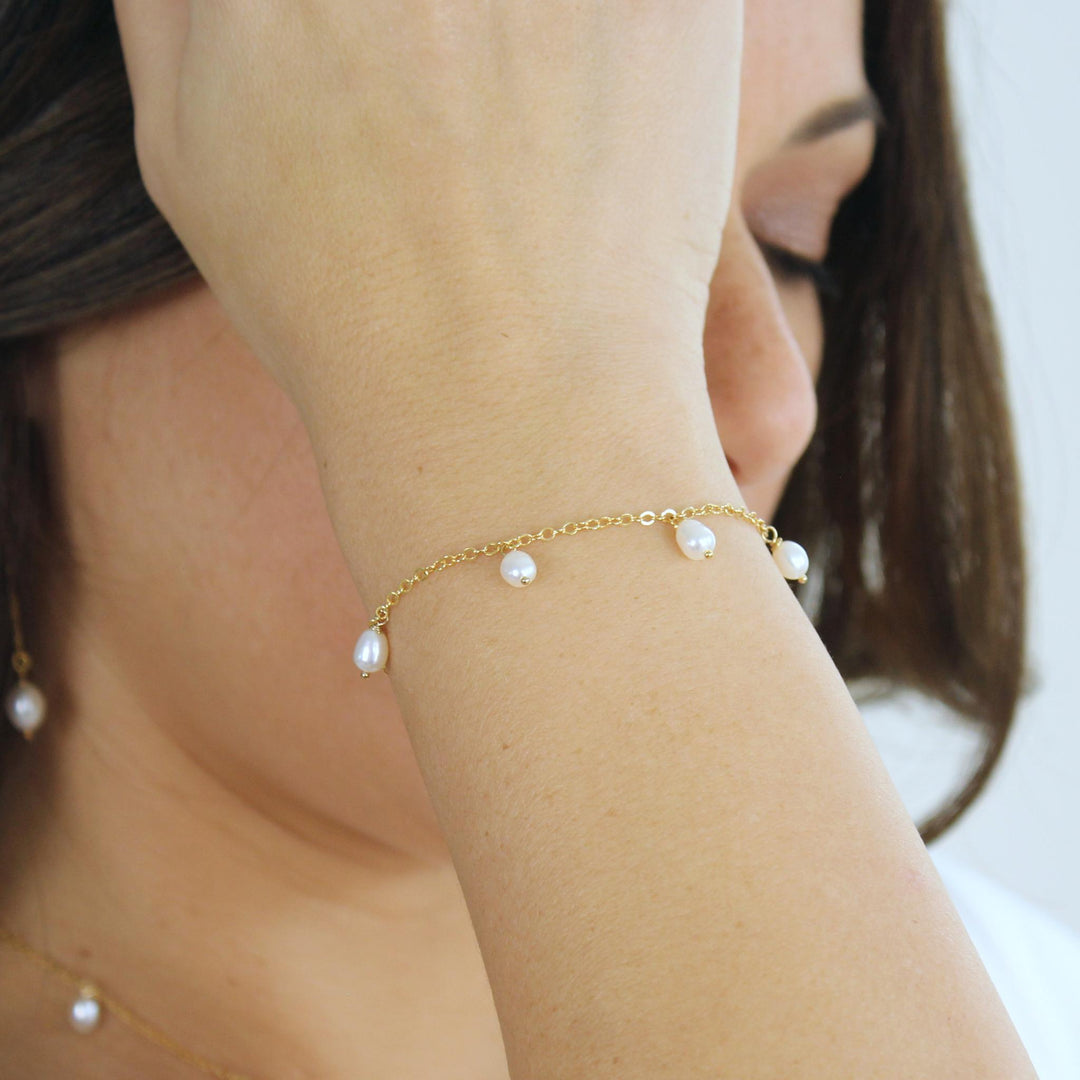 Calista Dangling Pearl Bracelet featuring freshwater pearls on a dainty chain